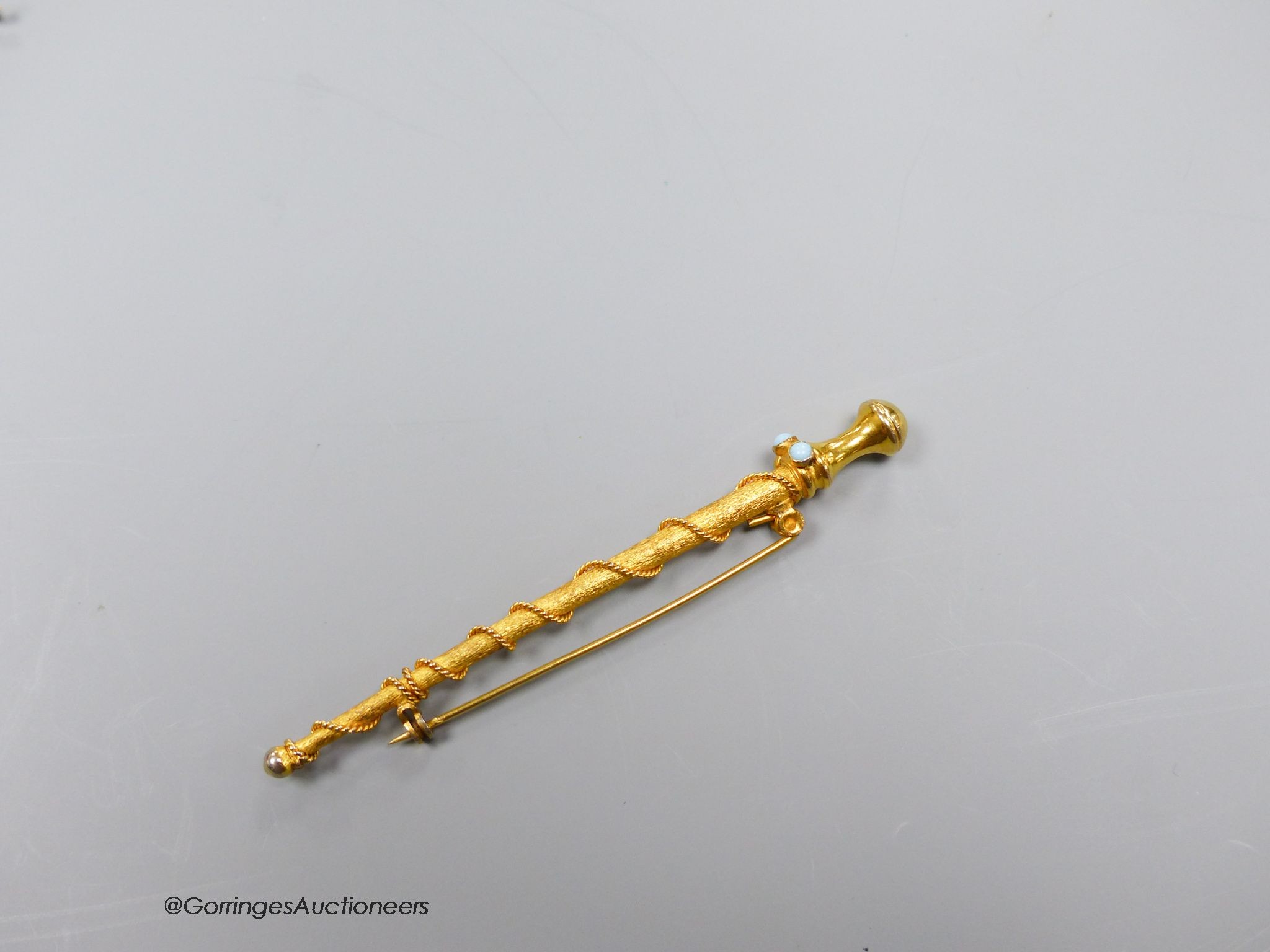 A gold turquoise set pin brooch, tests as 15ct, gross 10g, 9cm.